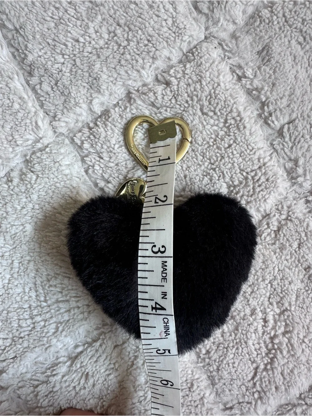 Juicy Couture | Black faux fur heart keychain charm featuring gold-tone Hardwear